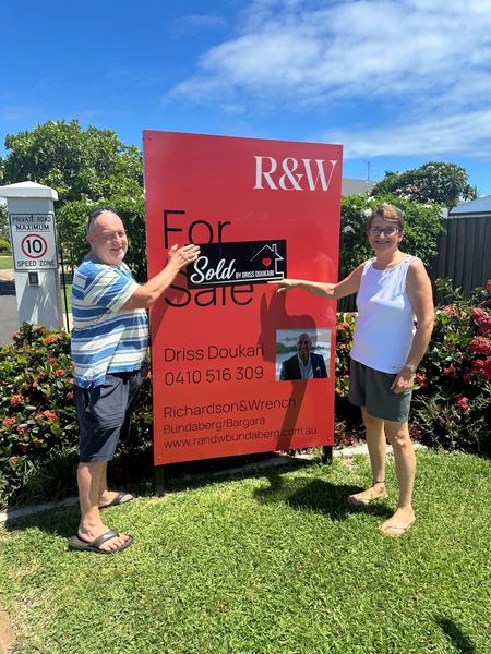 Sellers with sold sign